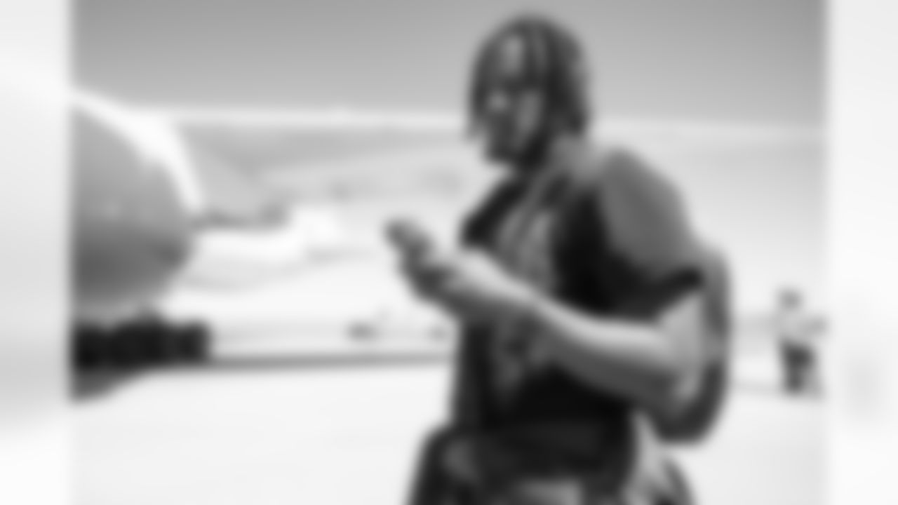 Nik Bonitto on the tarmac at Denver International Airport on September 11, 2022 during the team's travel to Seattle for a Week 1 game against the Seahawks. (Photo by Ben Swanson)