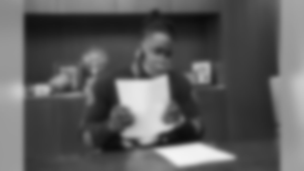 McTelvin Agim signs his rookie contract in Pat Bowlen's conference room at UCHealth Training Center on July 27, 2020. (Photo by Ben Swanson)