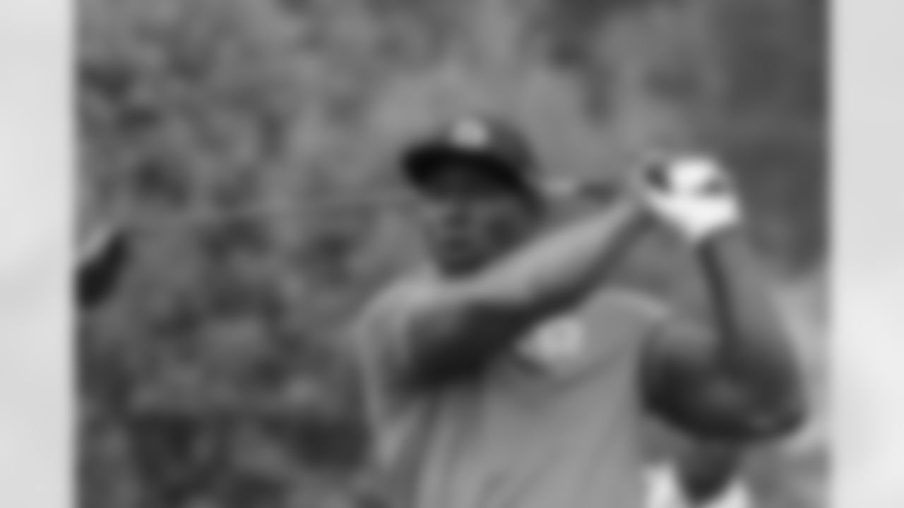 Former NFL football player Terrell Davis watches his drive from the third tee during the first round of the American Century Championship golf tournament at the Edgewood Tahoe Golf Course in Stateline, Nev., Friday, July 13, 2018. (AP Photo/Lance Iversen)