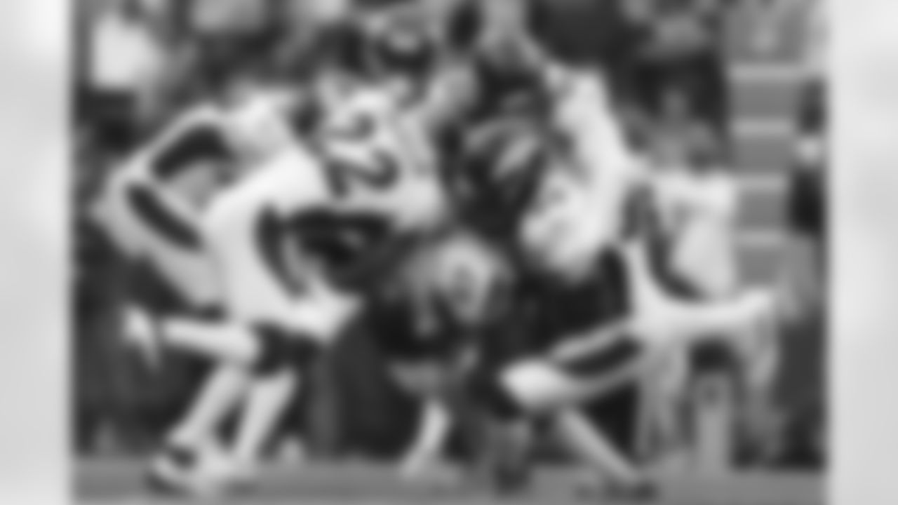 Denver Broncos safety Kareem Jackson (22), linebacker Alex Singleton (49), linebacker Bradley Chubb (55) and linebacker Jonas Griffith (50) gang tackle Seattle Seahawks tight end Noah Fant (87) during a NFL game against the Seattle Seahawks on Monday, September 12, 2022 at Lumen Field in Seattle, Washington.
Photo by Gabriel Christus/Denver Broncos