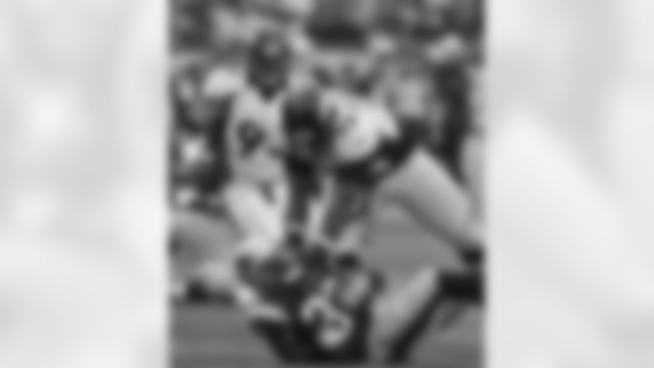 DT Kevin Vickerson throws the New England ballcarrier to the ground.