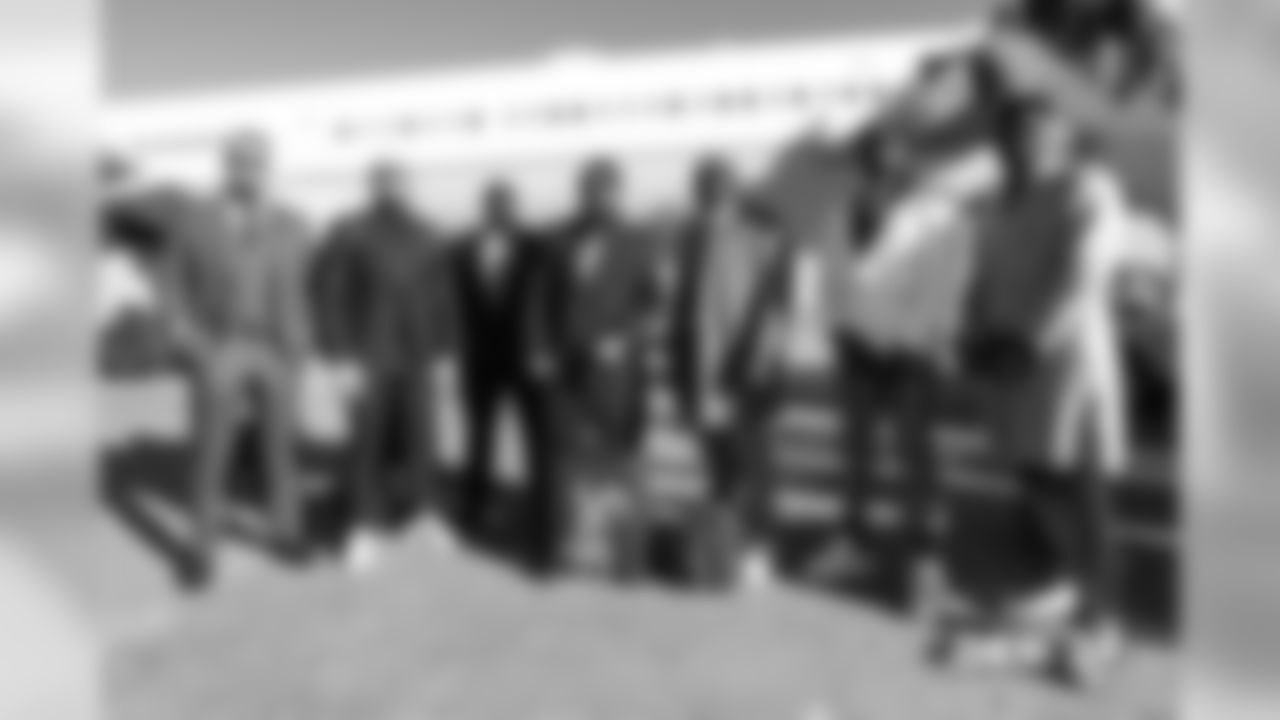 Derek Wolfe, Adam Gotsis, Shelby Harris, Domata Peko Sr., Zach Kerr, Jeff Holland and Shaquil Barrett walks on the tarmac during the team's travel to San Francisco on December 8, 2018 for their Week 14 game against the 49ers.