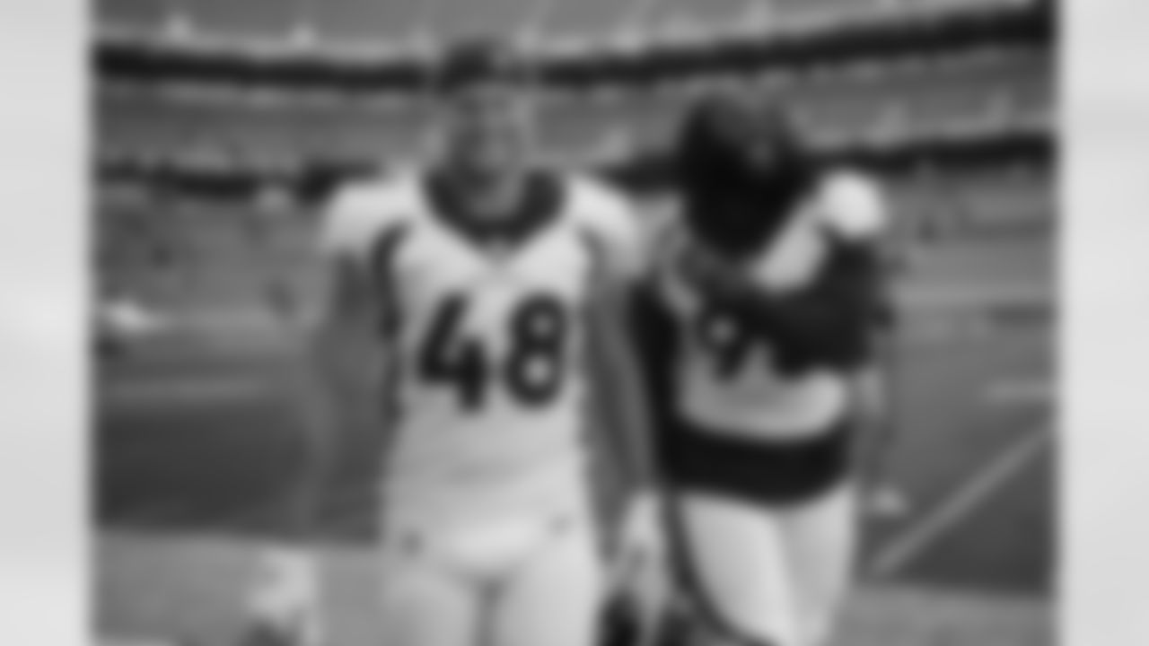 Derrek Tuszka and McTelvin Agim after practice on Day 12 of training camp at Empower Field at Mile High on August 29, 2020. (Photo by Ben Swanson)