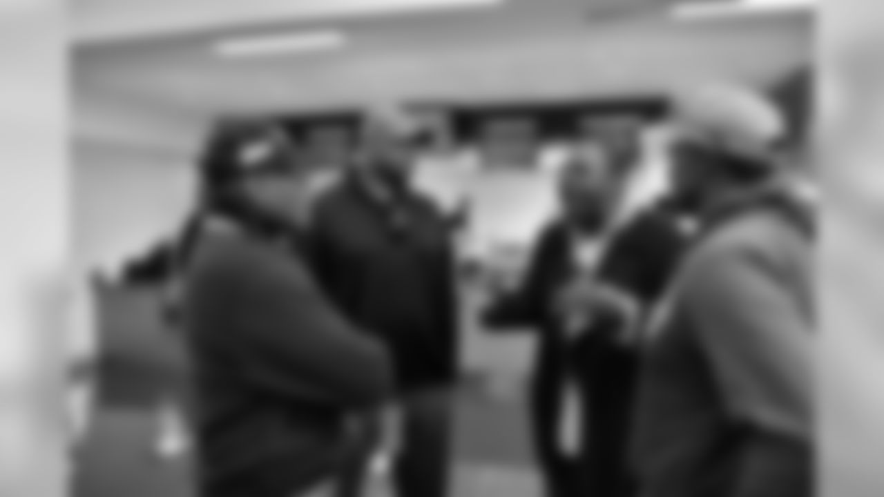 Floyd Little, Neil Smith, Tom Jackson and Billy Thompson converse in the cafeteria.