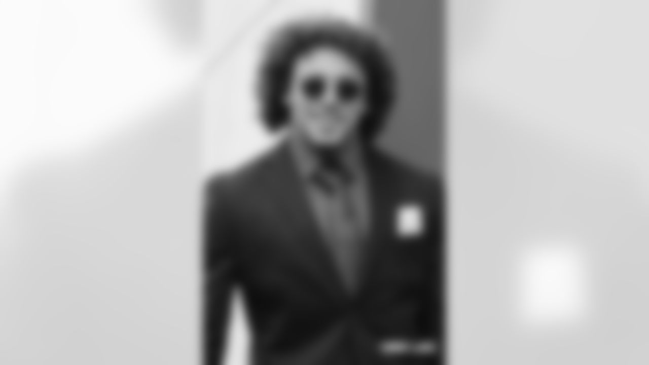 Phillip Lindsay walks to the bus during the team's travel on Nov. 17, 2018 ahead of its game against the Los Angeles Chargers