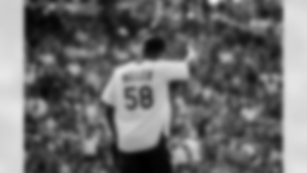 Von Miller points to the crowd at the 2021 MLB All-Star Celebrity Softball Game at Coors Field on July 11, 2021. (Photo by Ben Swanson)