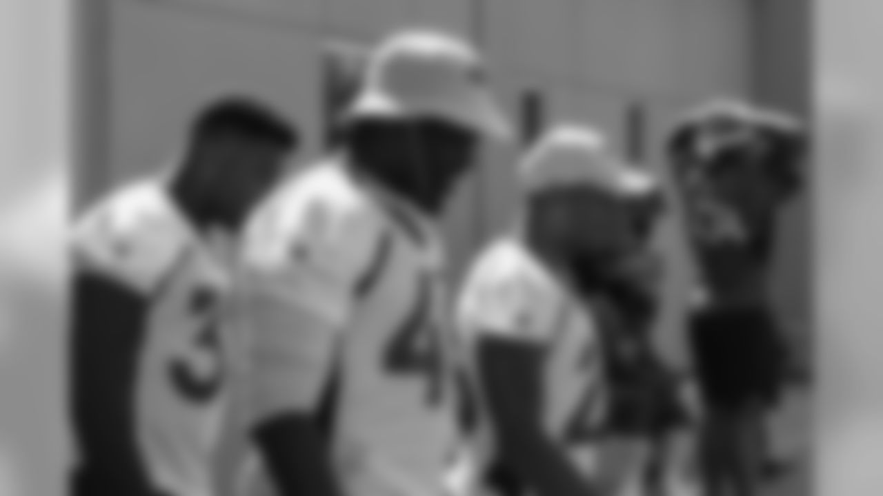 (from left to right) Dymonte Thomas, Shaquil Barrett and Chris Harris Jr. head out to practice on Sept. 8, 2018.