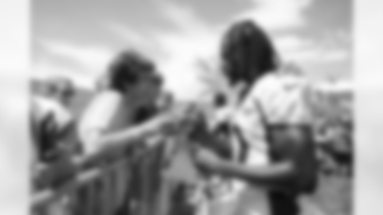 Jerry Jeudy signs autographs for fans during a training camp practice at Centura Health Training Center on July 28, 2023 in Englewood, Colorado. Photo by Ben Swanson / Denver Broncos