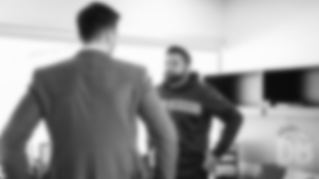 Joe Flacco talks with Quarterbacks Coach T.C. McCartney during Flacco's first day as a Bronco at UCHealth Training Center following a trade to Denver on March 15, 2019.