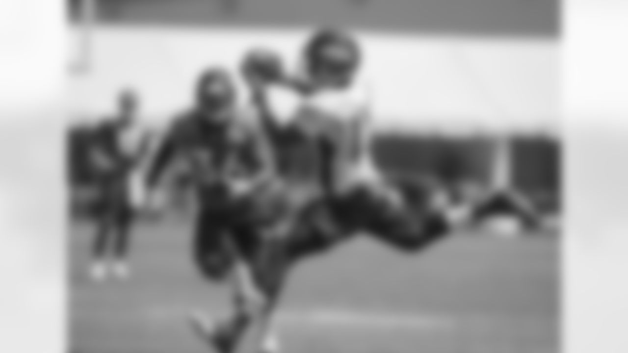 Bateman makes a grab on the run.