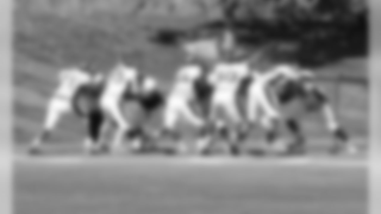 The Broncos offensive line works through a drill.