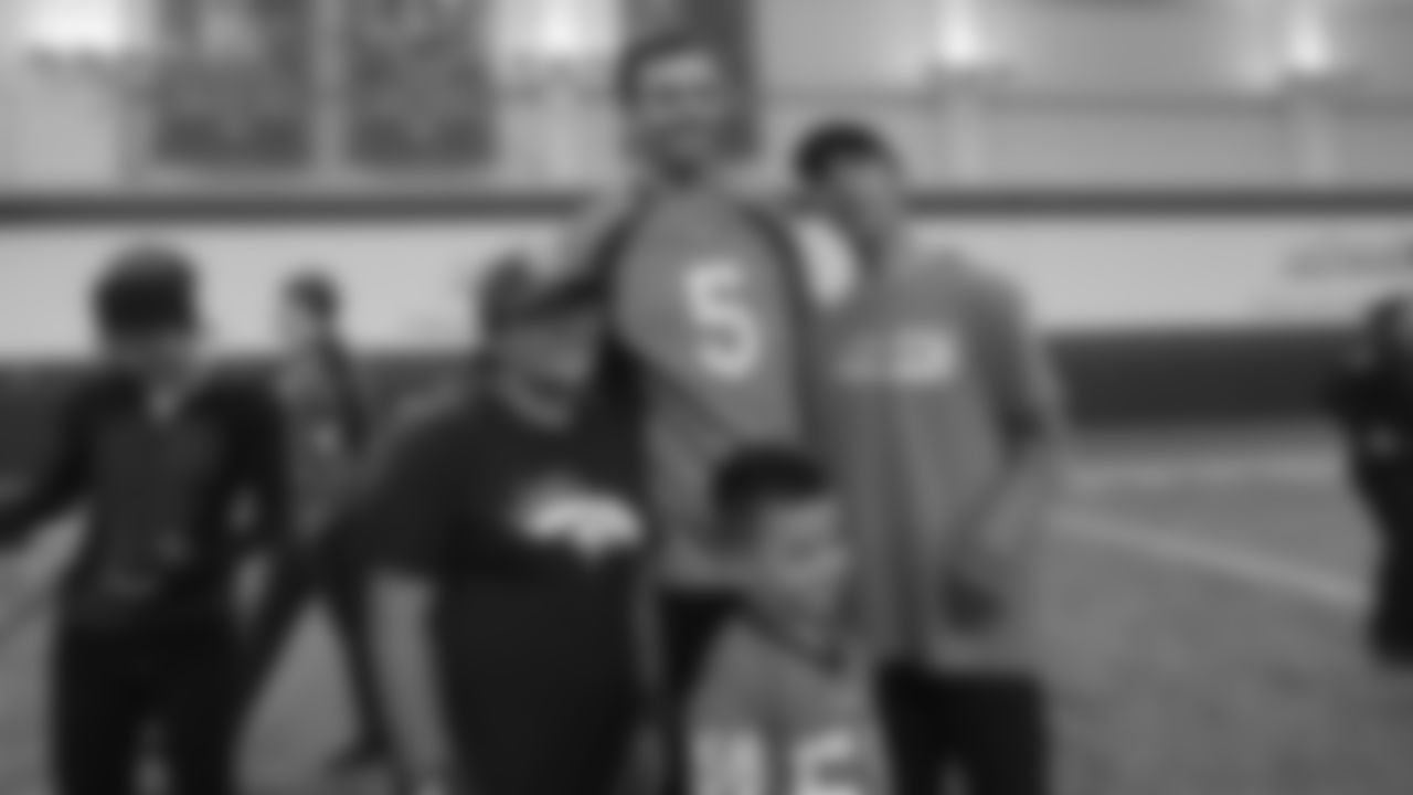 Joe Flacco poses for a group photo during a PLAY 60 All-Ability Clinic with Special Olympics Colorado for 125 athletes at UCHealth Training Center at May 7, 2019.