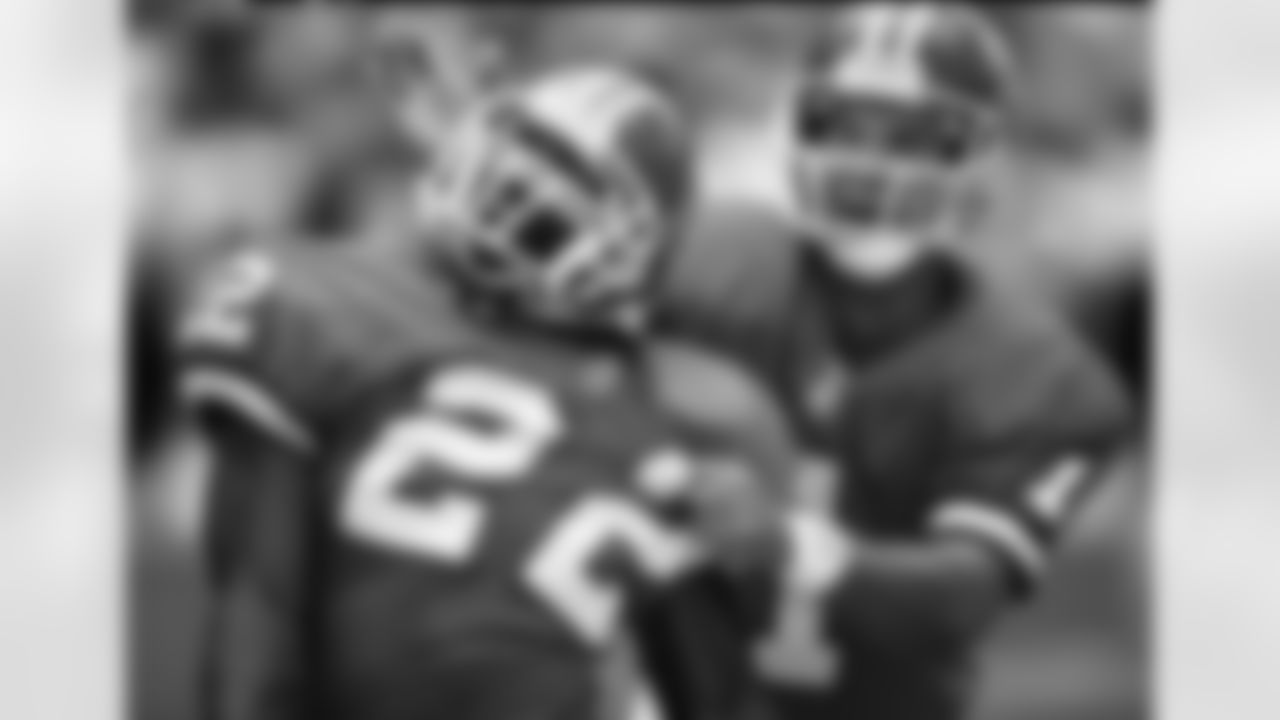 Kicker Jason Elam (1) of the Denver Broncos celebrates with running back Vaughn Hebron (22) during play against the New York Jets September 1, 1996 in Denver, Colorado. (AP Photo / Al Messerschmidt)
