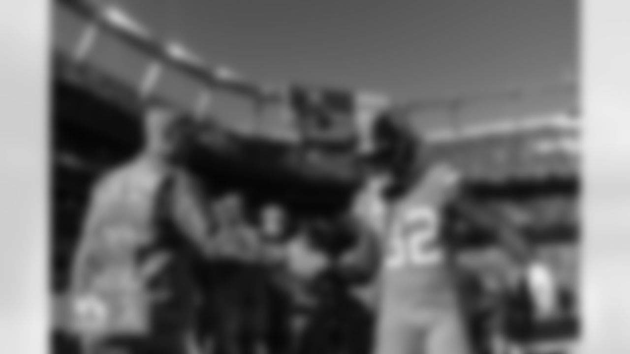 Delarrin Turner-Yell high-fives military service members on his way off the field during warmups before the Broncos' Week 11 game against the Las Vegas Raiders at Empower Field at Mile High in Denver, Colorado on November 20, 2022. (Photo by Ben Swanson)