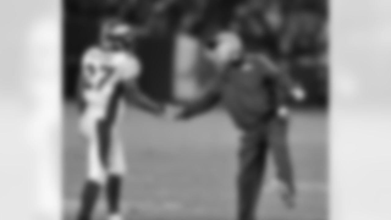 Moreno is congratulated by Head Coach John Fox.