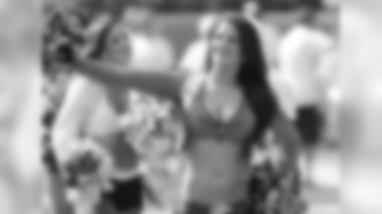 Denver's Pro Bowl cheerleader Tara waves to the fans.