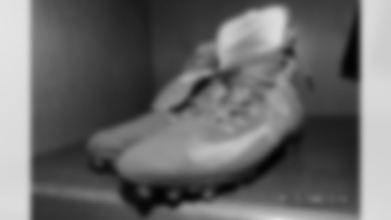 Derek Wolfe's cleats in the locker room pregame before the Broncos' Week 6 game against the Los Angeles Rams at Broncos Stadium at Mile High on October 14, 2018.