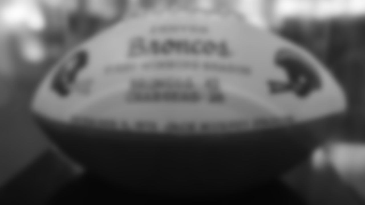 A game ball commemorating the Broncos' first winning season in 1973 is featured in a display at the open-house tribute to Pat Bowlen at Broncos Stadium at Mile High on June 18, 2019.