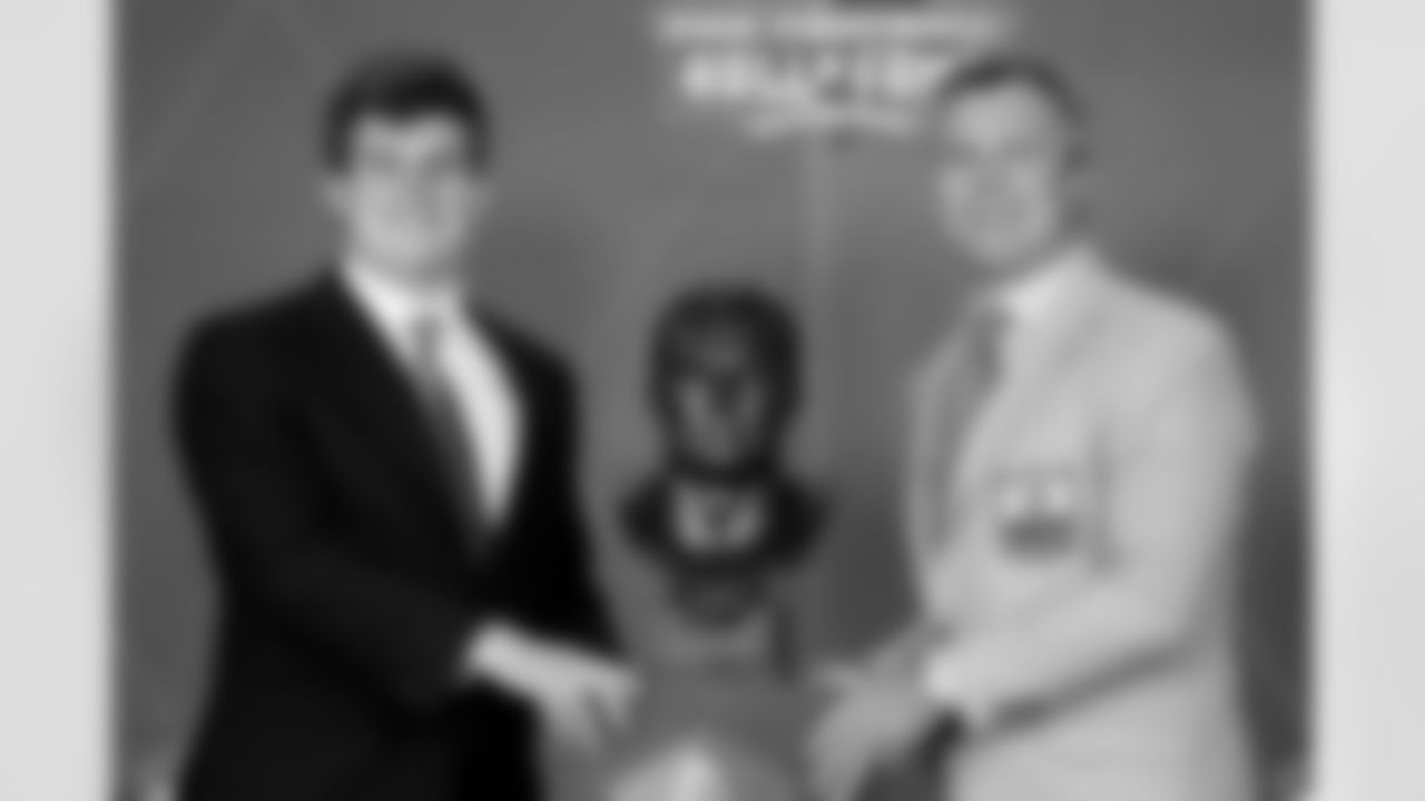 John Lynch stands next to bust with his son Jake during the 2021 Hall of Fame Weekend on Sunday, August 8, 2021 in Canton, Ohio. (Lauren Bacho/NFL)