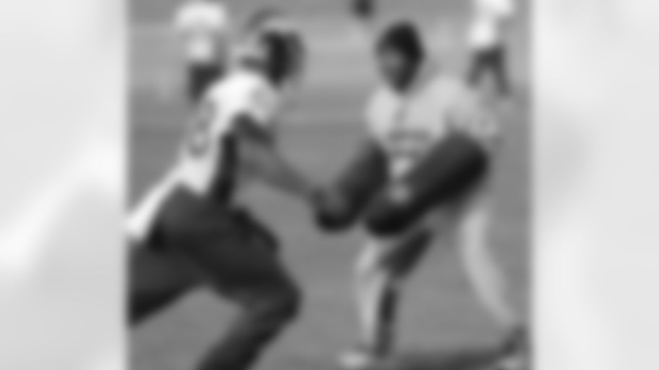 WR Demaryius Thomas looks to get past WR Coach Tyke Tolbert.