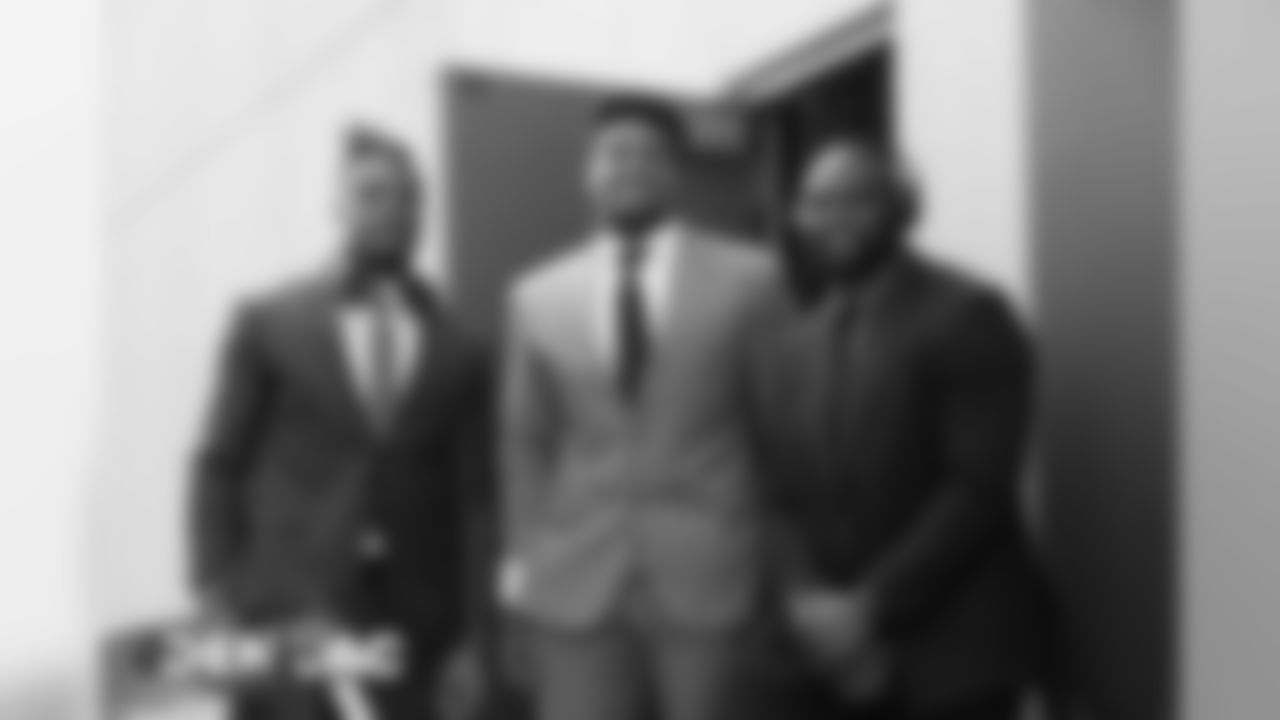 Josh Watson, Dre'Mont Jones and Deyon Sizer pose for a photo as they walk to the bus during the team's travel to California on October 5, 2019 ahead of their Week 5 game against the Los Angeles Chargers. (Photo by Emily Simanskis)