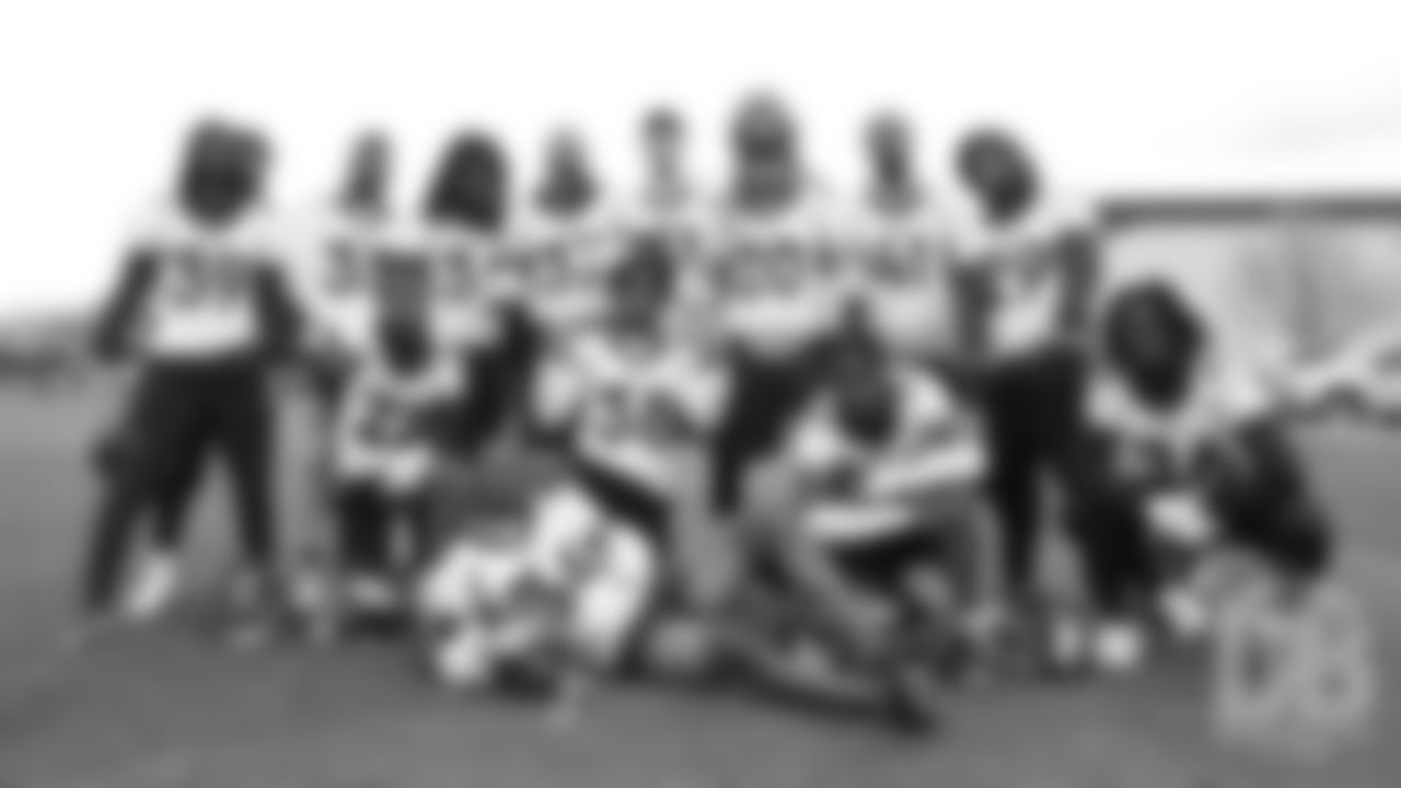 A slew of defensive backs pose for a photo together during the third and final day of voluntary veteran minicamp on April 18, 2019.
