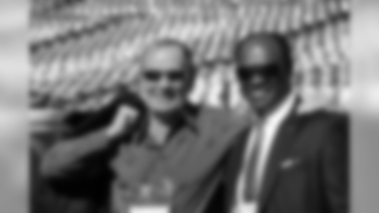 Owner and CEO Pat Bowlen with former player and community development staff member Billy Thompson prior to action against the San Diego Chargers in the NFL game at Qualcomm Stadium in San Diego,CA November 10, 2013.