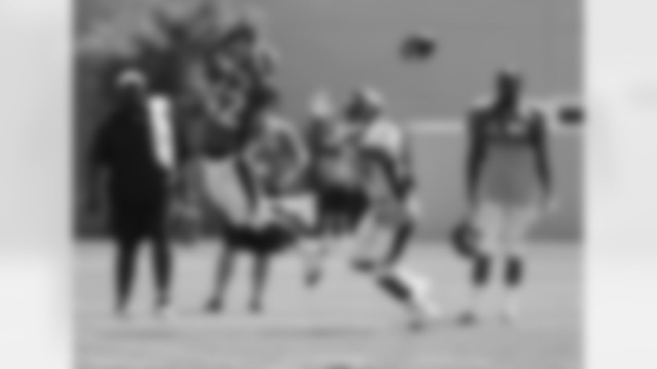 Malone breaks up a pass.