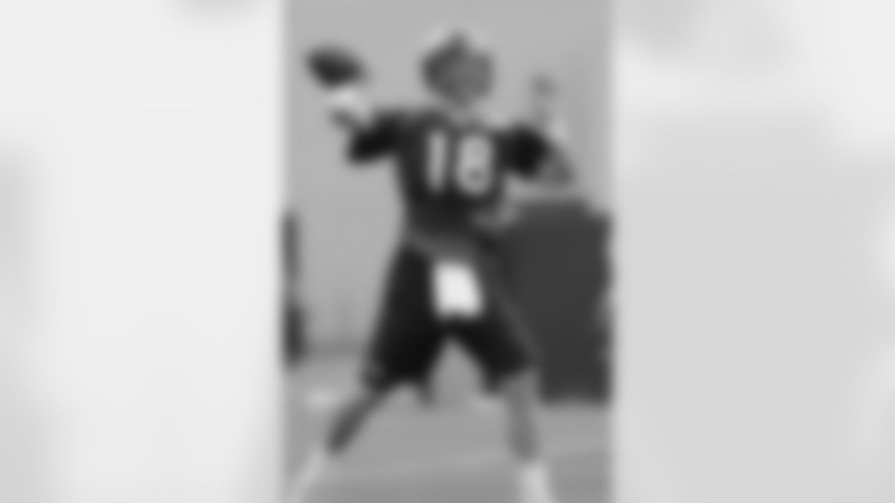 Manning launches a pass.
