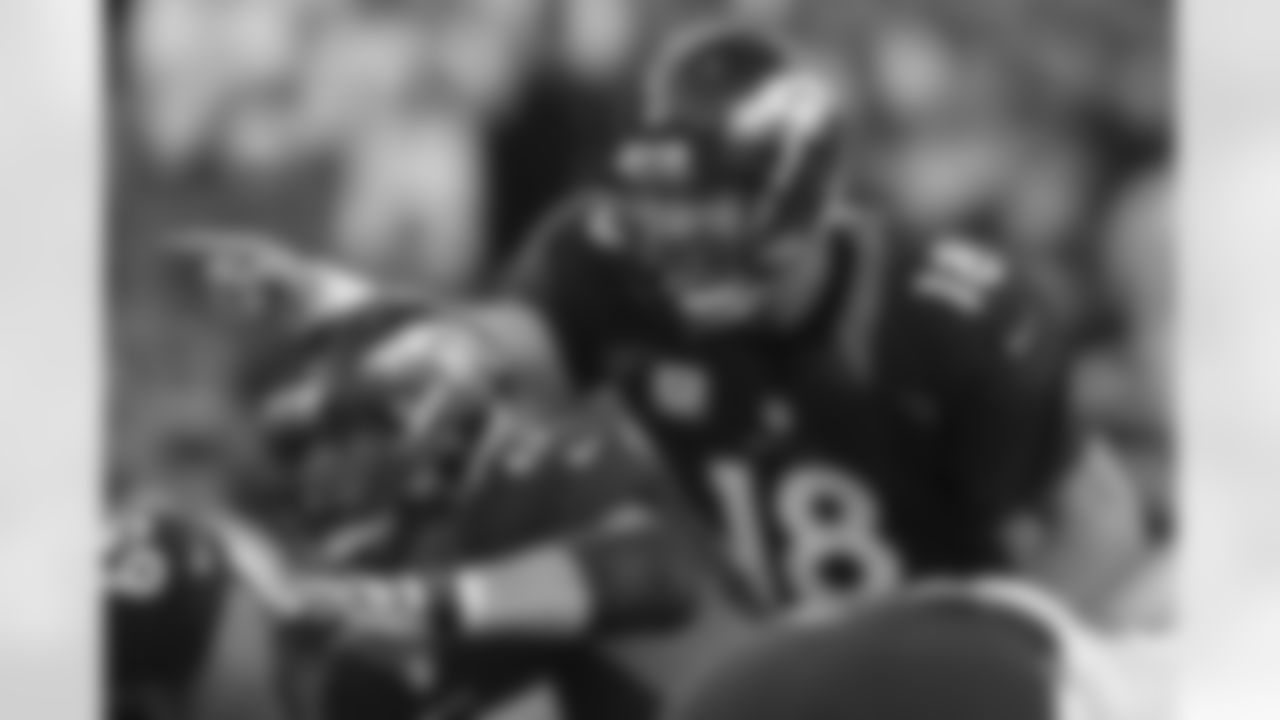 Manning makes a call before taking the snap.