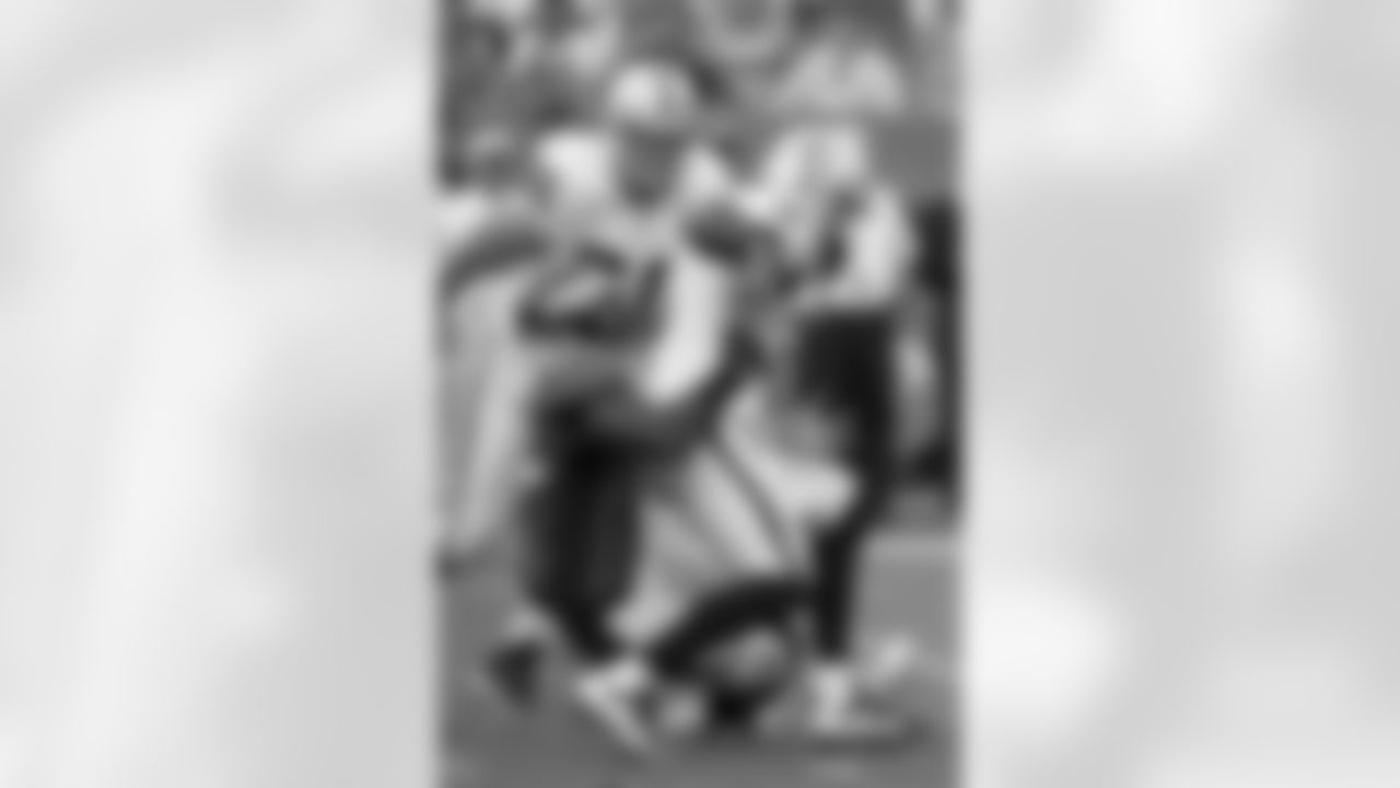 Dumervil strip-sacks Carson Palmer in the fourth quarter.