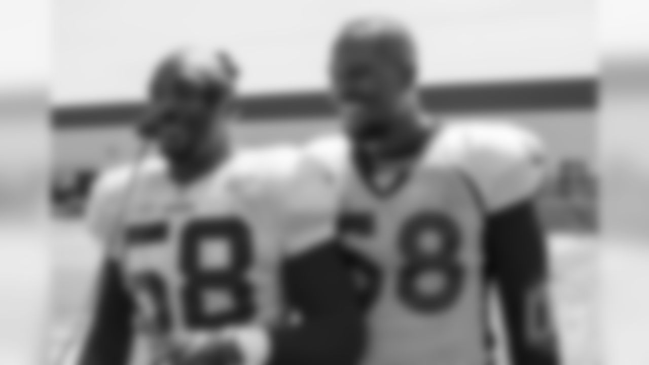 Elvis Dumervil and Von Miller, who were Broncos teammates during Miller's first years in the league