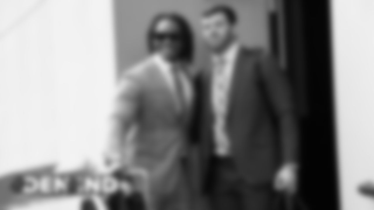 Todd Davis and Josey Jewell walk to the bus during the team's travel to Indiana on October 26, 2019 ahead of their Week 8 game against the Indianapolis Colts. (Photo by Emily Simanskis)