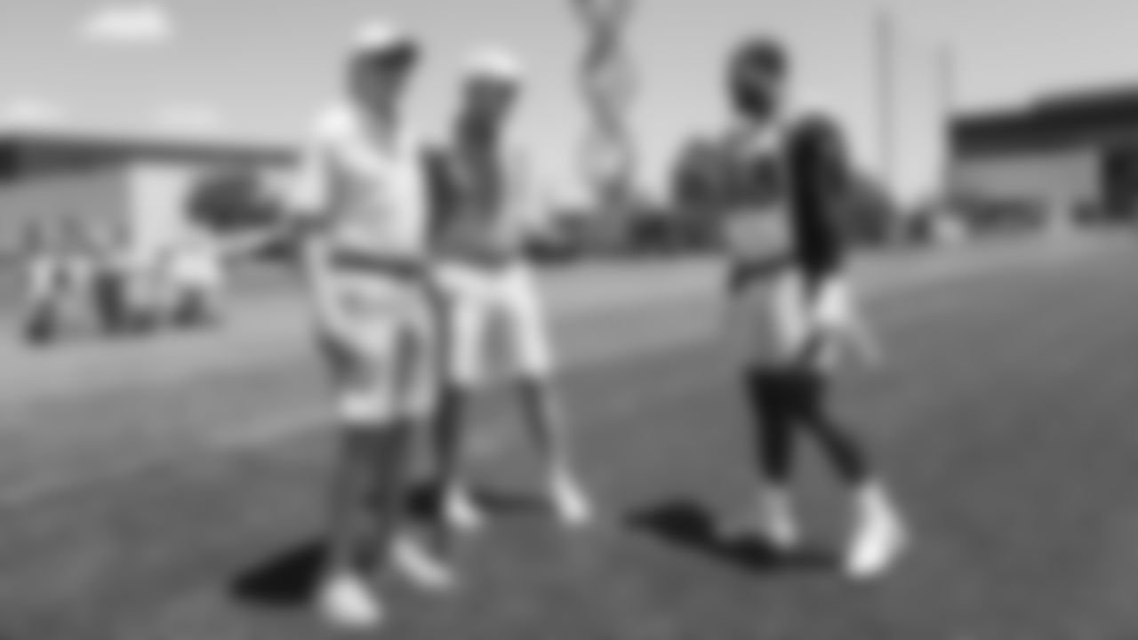 Archie and Peyton Manning chat briefly with Von Miller during the Broncos' second mandatory minicamp practice on June 5, 2019.