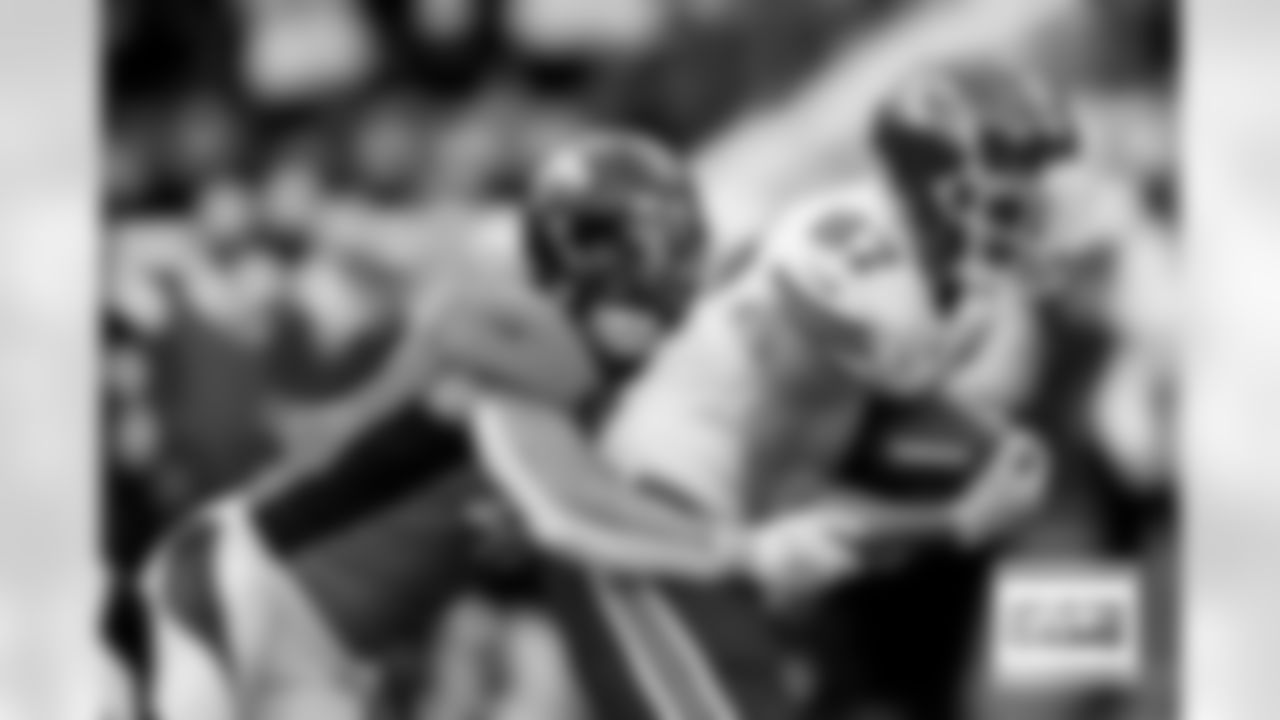 Denver Broncos linebacker Josey Jewell (47) tackles Kansas City Chiefs tight end Travis Kelce (87) during the Broncos' Week 8 game against the Kansas City Chiefs at Empower Field at Mile High in Denver, Colorado on October 29, 2023. Photo by Ben Swanson / Denver Broncos