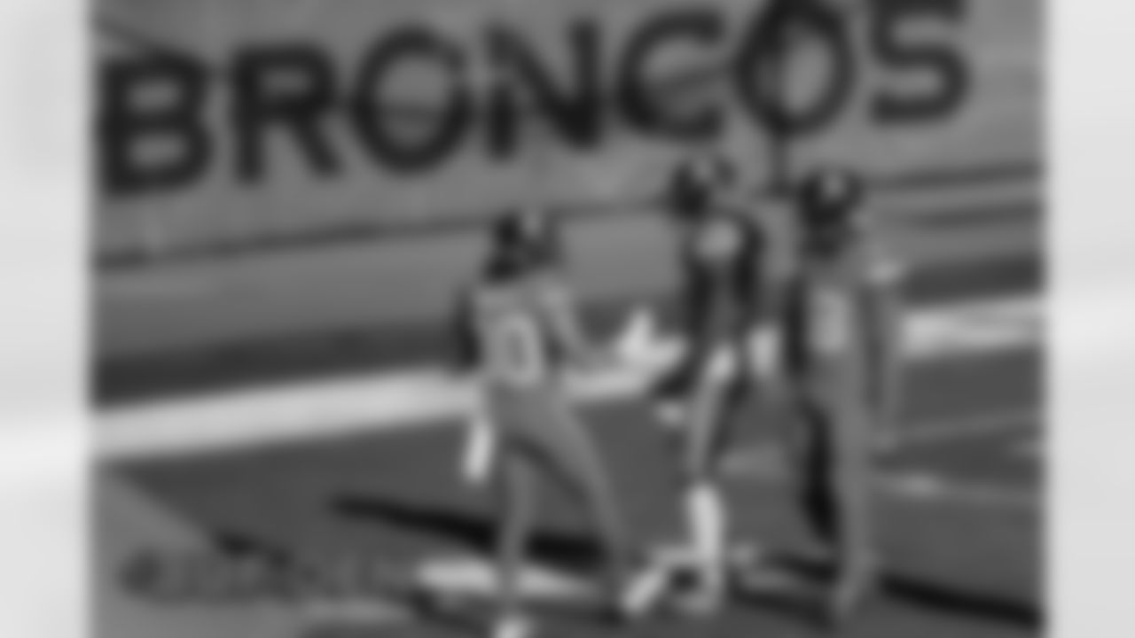 Phillip Lindsay, Melvin Gordon III and Royce Freeman warm up before the Broncos' Week 15 game against the Buffalo Bills at Empower Field at Mile High in Denver, Colorado on December 19, 2020. (Photo by Gabriel Christus)