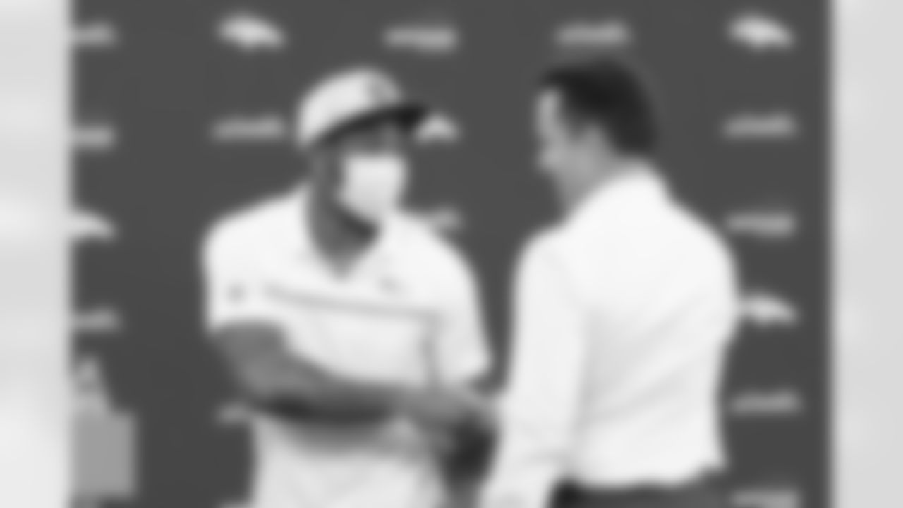 George Paton shakes hands with Ronald Darby during a press conference introducing free agents Ronald Darby and Michael Boone at UCHealth Training Center in Centennial, CO, March 18, 2021.
Photo by Gabriel Christus