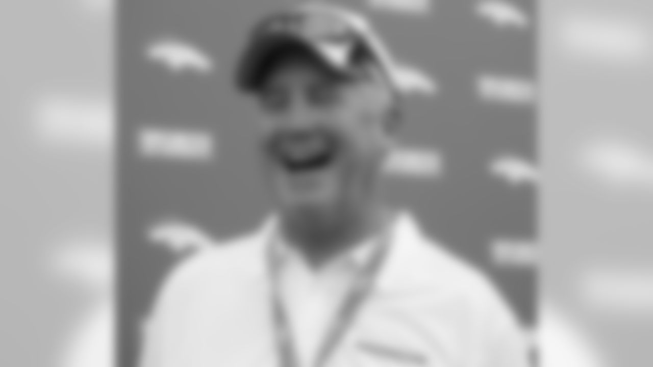 Head Coach John Fox laughs during his meeting with the press.