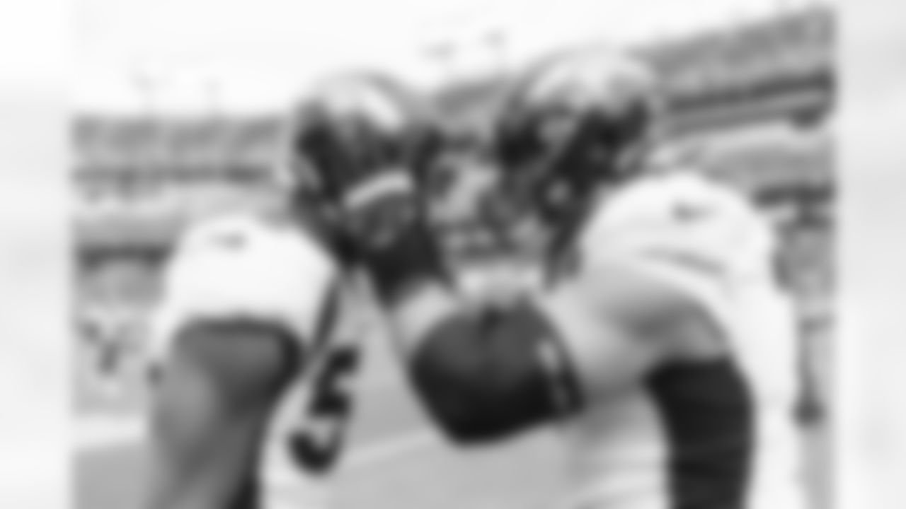 Quinn Meinerz hypes up Jonathon Cooper during warmups at the Broncos' Week 10 game against the Tennessee Titans at Nissan Stadium in Nashville, Tennessee on November 13, 2022. (Photo by Ben Swanson)