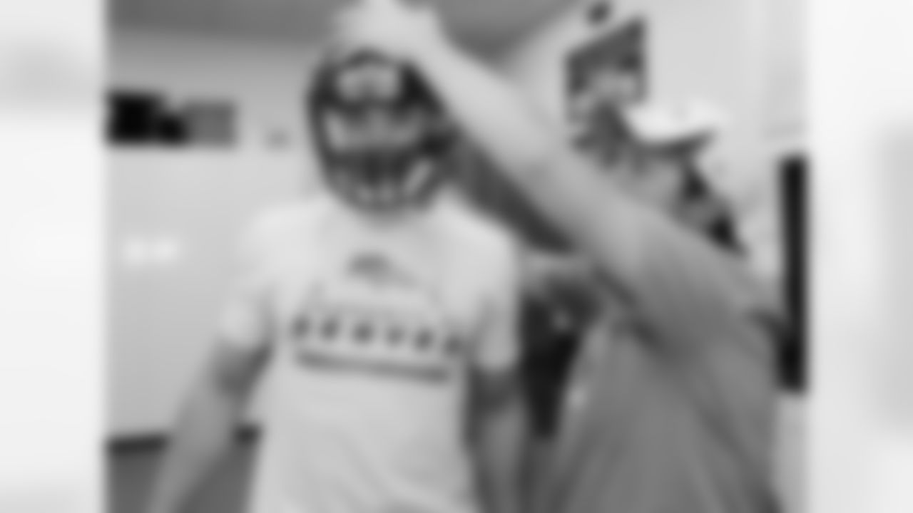 Arkansas safety Ross Rasner has his helmet adjusted.