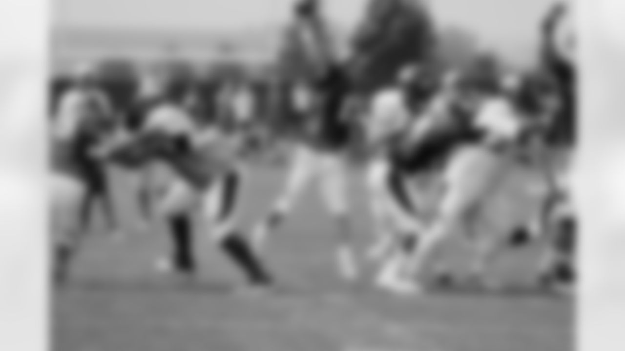 Manning fires a pass.