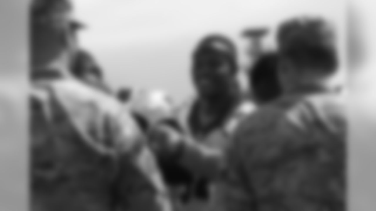 Will Parks meets military members who visited and viewed practice as part of a USAA luncheon on June 4, 2019.
