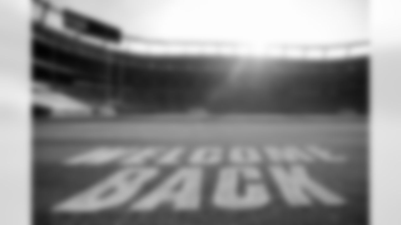 Members of the stadium's turf crew paint the field at Empower Field at Mile High on September 23, 2021 ahead of the team's Week 3 home opener. (Photo by Ben Swanson)