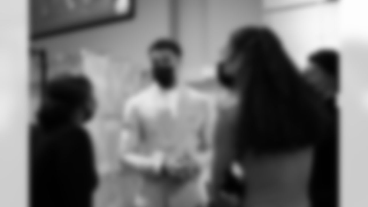 Justin Simmons talks with Nashara Ellerbee and Naja'Ray West, both picked as 2021 Community MVPs, at the Justin Simmons Foundation's "An Evening with Justin Simmons, presented by U.S. Bank" at Empower Field at Mile High in Denver, Colorado on December 14, 2021. (Photo by Ben Swanson)
