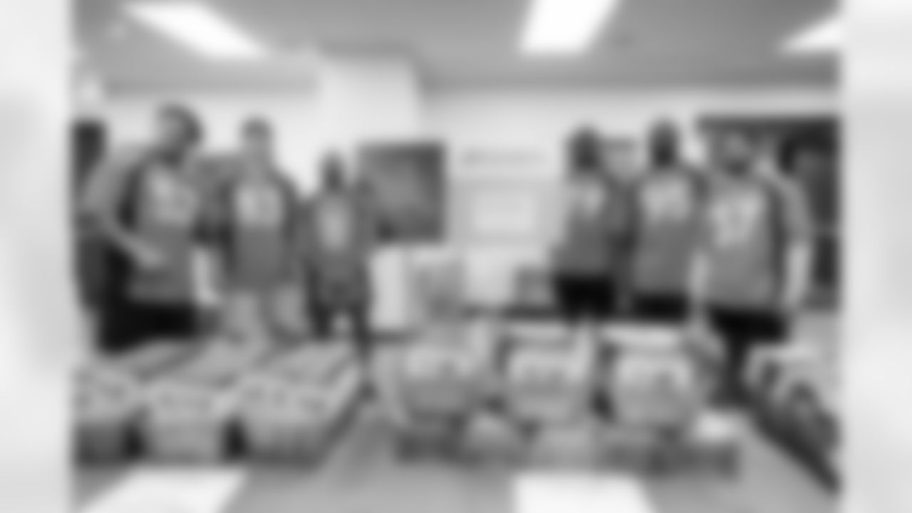 Netane Muti, Andrew Beck, Diontae Spencer, Lloyd Cushenberry III, McTelvin Agim and P.J. Locke during a community event packaging school supplies provided by King Soopers in 300 backpacks for students on August 31, 2021. (Photo by Ben Swanson)