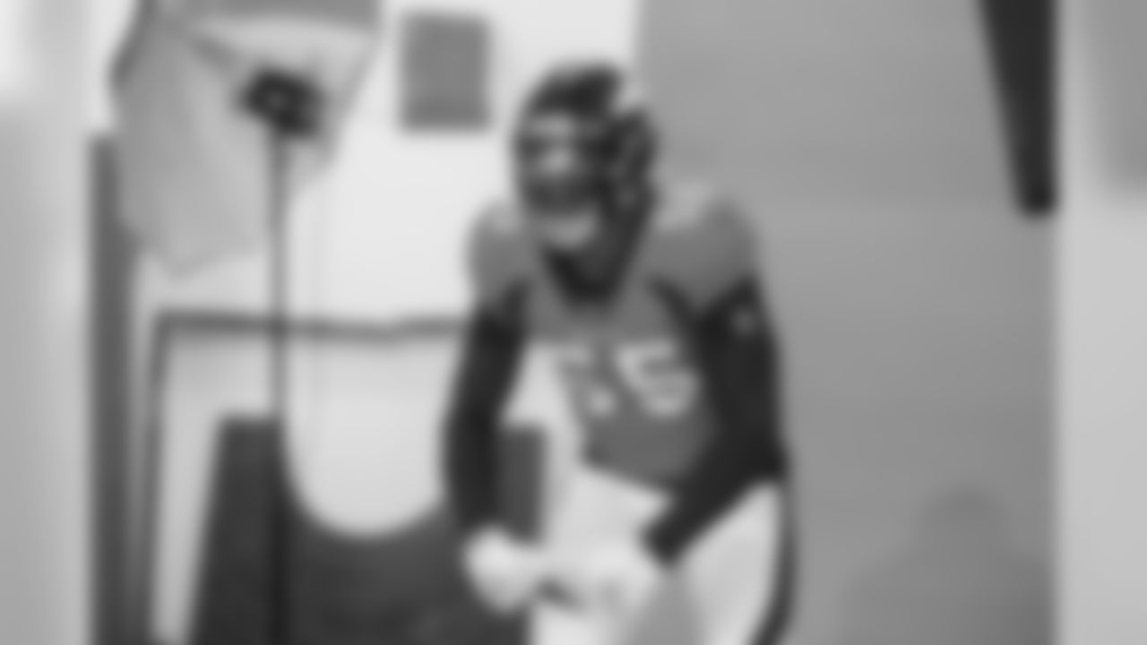 Bradley Chubb flexes and yells during a media session with green screens and a photo studio for early reports at UCHealth Training Center on July 31, 2020. (Photo by Ben Swanson)