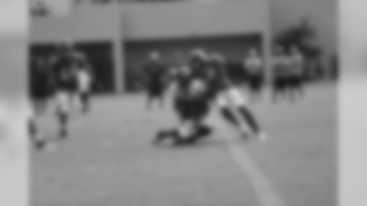 Quentin Jammer lays a hit on Virgil Green.
