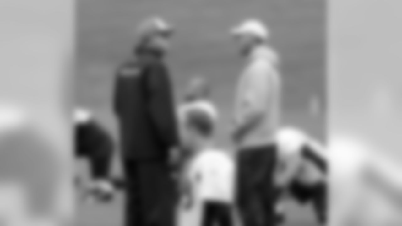 Jack Del Rio and Adam Gase