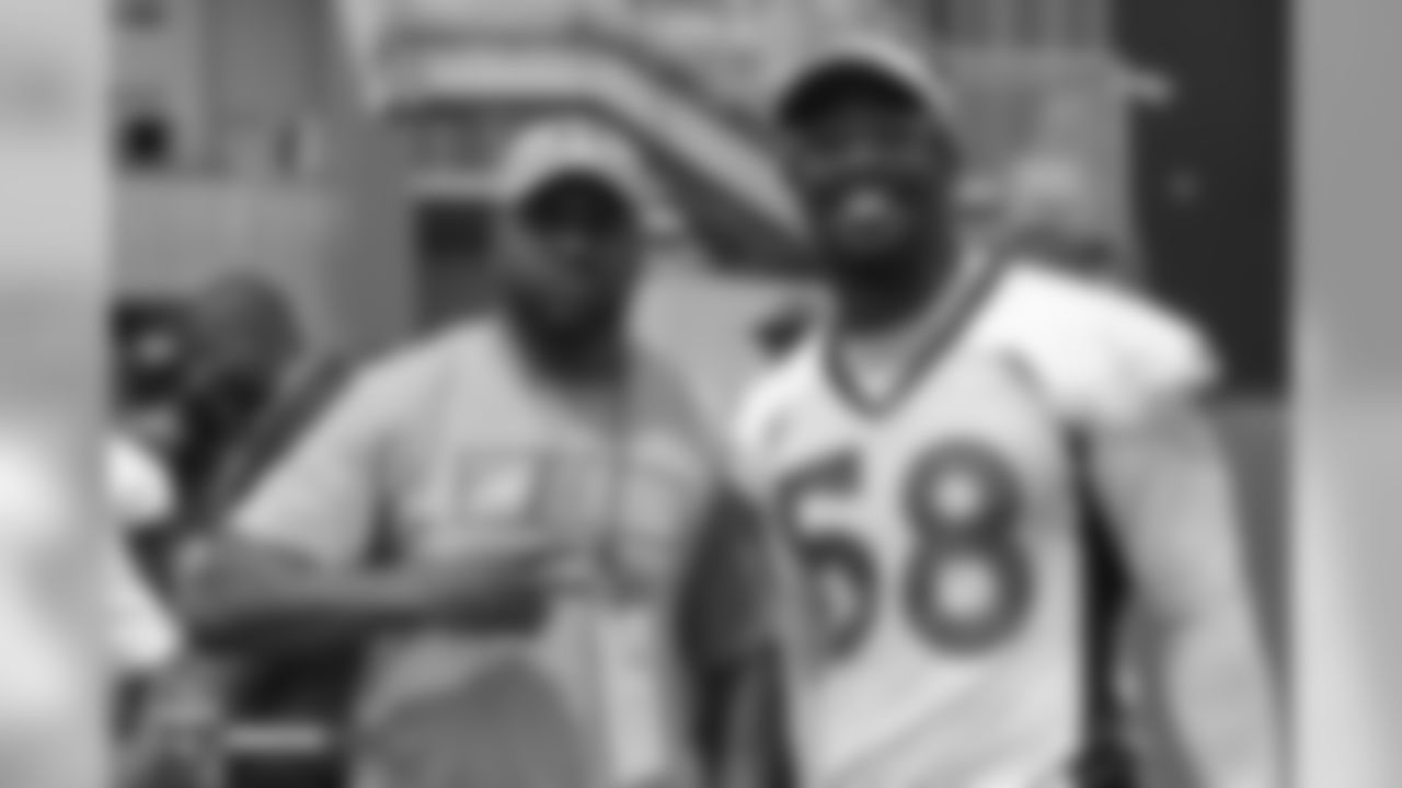 Former Bronco Tatum Bell and outside linebacker Von Miller (58) during the 10th day of training camp on August 8, 2018, at UCHealth Training Center.