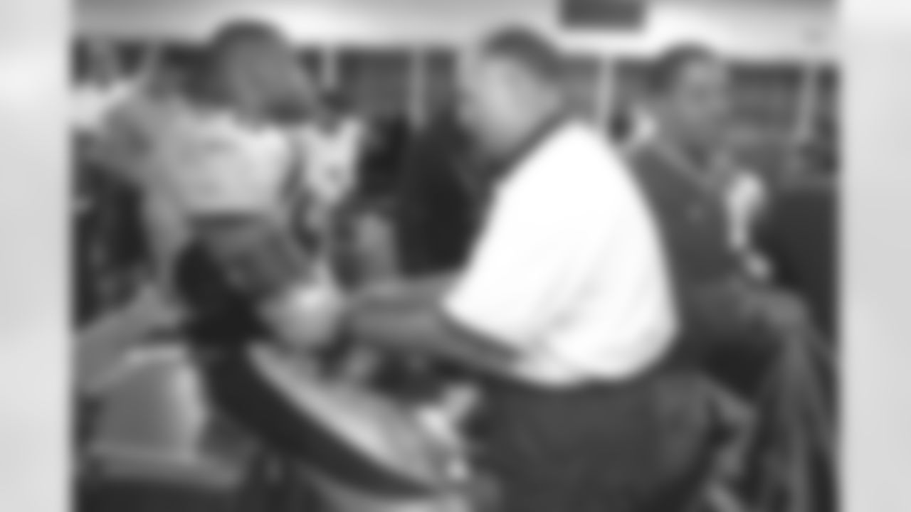 San Diego: Head trainer Steve Antonopulos tends to Neil Smith after the game against the San Diego Chargers at Jack Murphy Stadium in San Diego, CA on November 30, 1997.